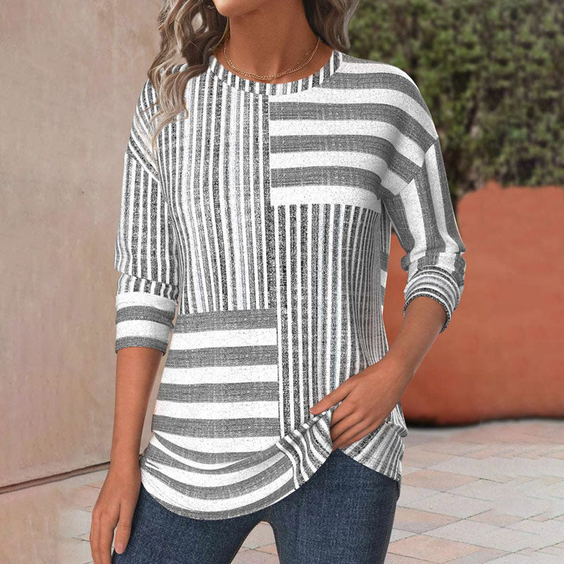 Women's striped short sleeve blouse in a relaxed fit. Perfect for casual wear, work, or chic everyday fashion.