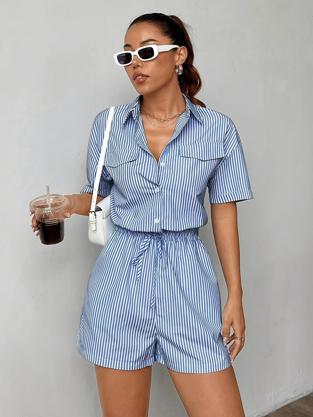 Striped women's jumpsuit, short-sleeved and elastic-waisted, great for everyday summer fashion.