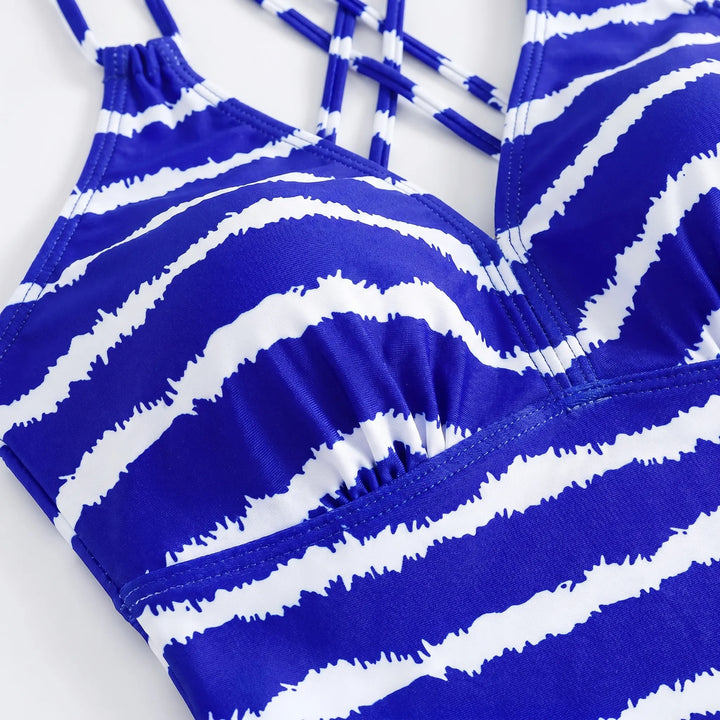 Comfortable women's striped tankini swimsuit. Two-piece set, ideal beachwear with adjustable straps for summer.