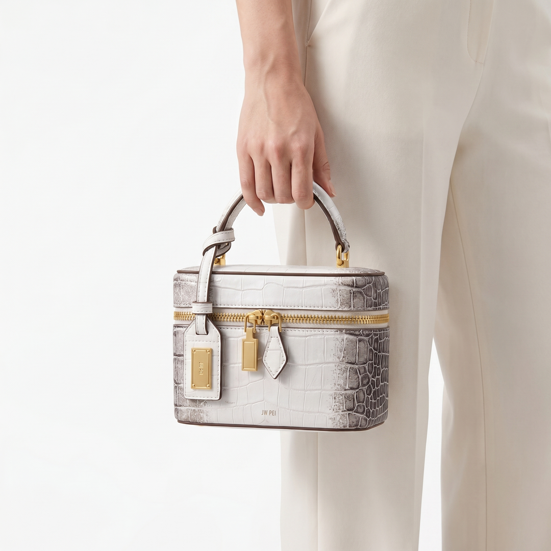 Chic women's box bag; structured design with luxurious embossed crocodile texture. A must-have accessory.