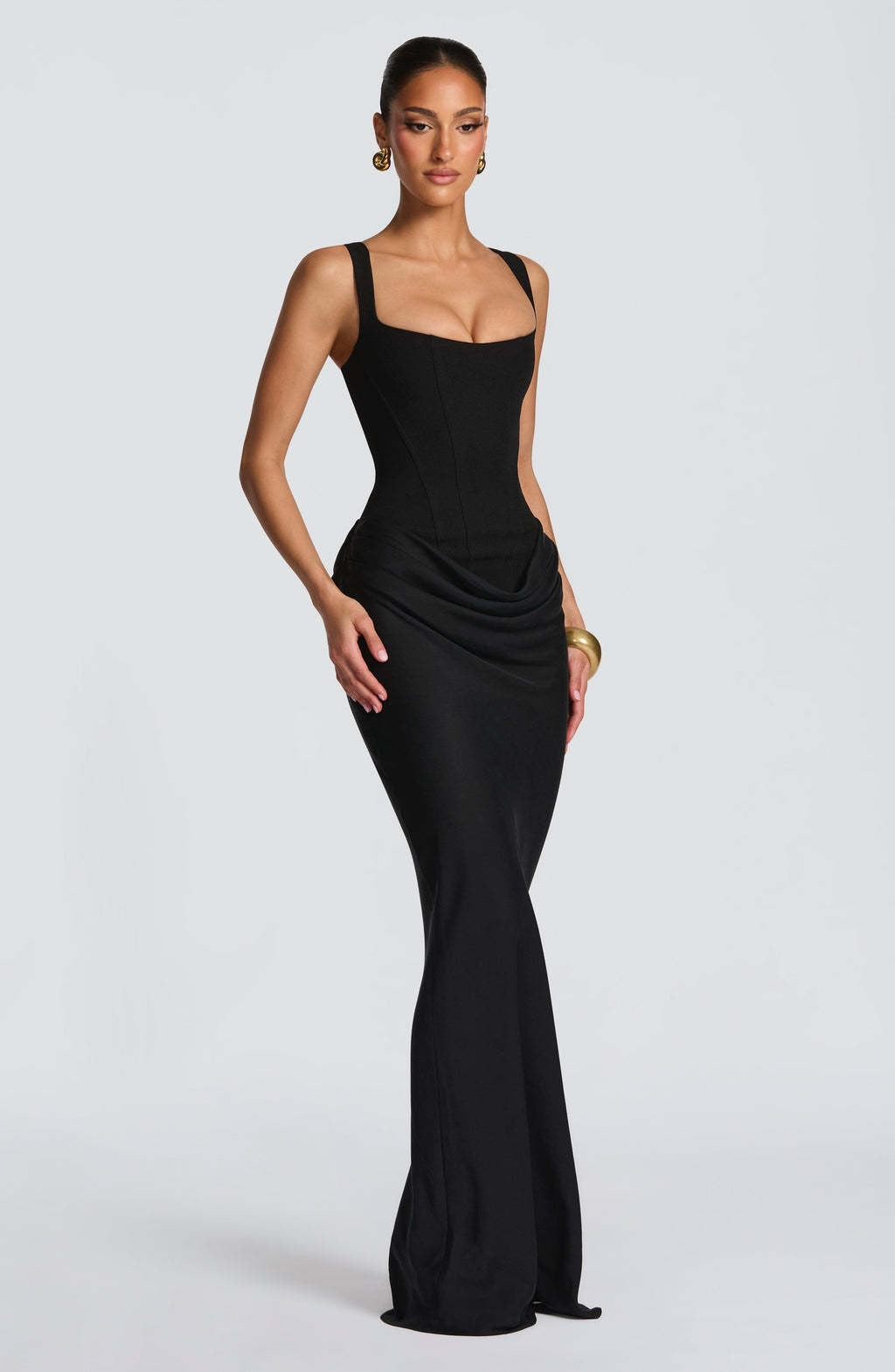 Sophisticated women's maxi dress, corset bodice, wide straps, floor-length, suitable for formal & party wear.