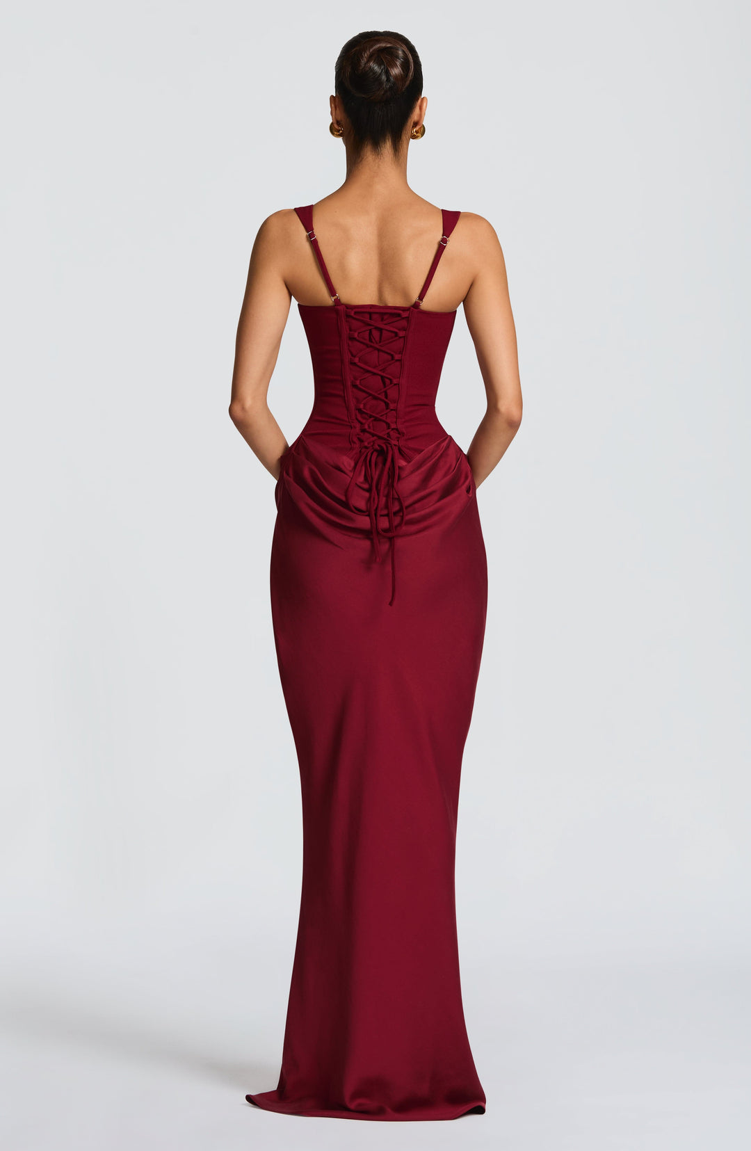 Formal women's evening wear maxi dress, structured corset, wide straps, flowing draped skirt for elegant occasions.