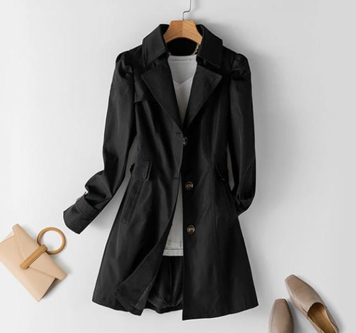Structured women's trench coat with button closure, a versatile fall & spring jacket for elegant office attire.
