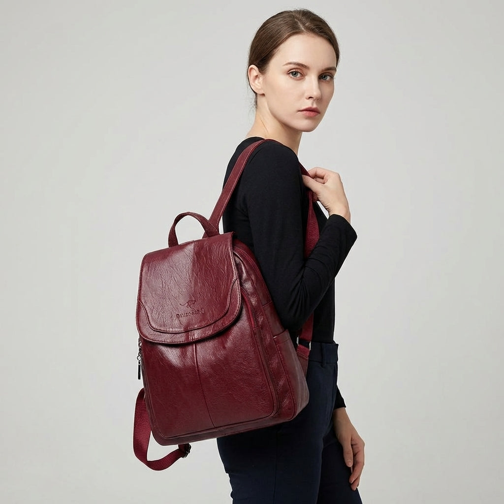 Fashionable women's flap backpack; a structured shoulder bag perfect for daily essentials & travel.
