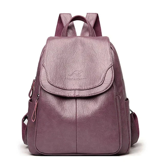 Elegant structured women's backpack with a secure flap, ideal for daily carry & fashion-forward looks.