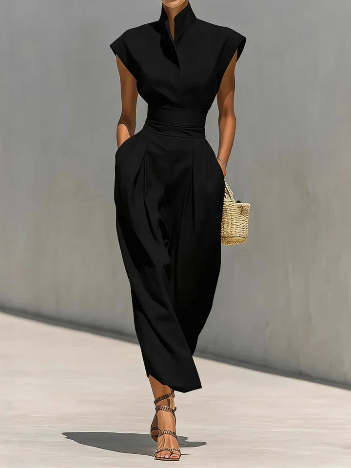 Sophisticated women's tailored midi dress, featuring a stand collar, cinched waist, and hidden pockets.