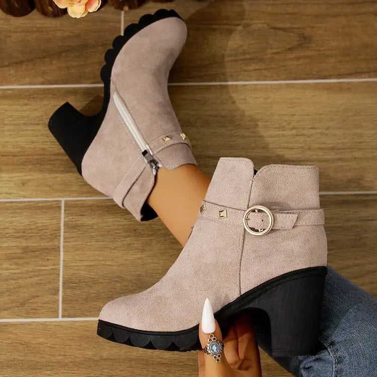 Edgy studded black block heel ankle boots for women, ideal for fall and winter fashion.
