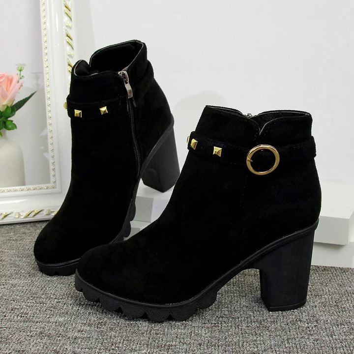 Women's dressy studded block heel boots, perfect for a chic fall or winter look.