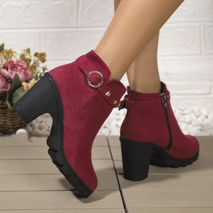 Trendsetting women's studded block heel fashion boots, combining comfort with edgy style.
