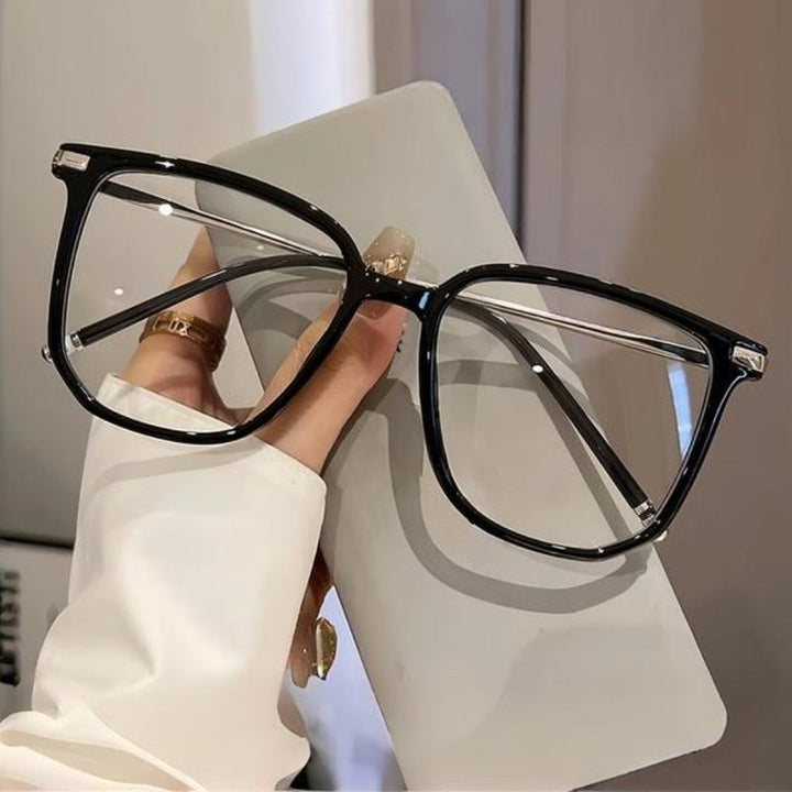 Minimalist women's sunglasses with UV protection, crafted from sleek acetate eyewear.