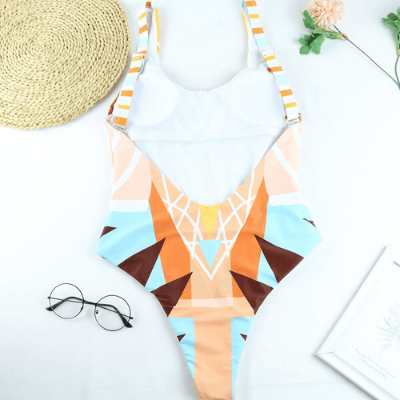 Women's one-piece swimsuit in a vibrant animal print, perfect for beach or pool