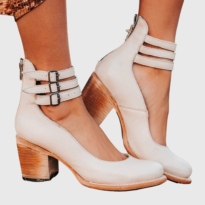 Stylish women's ankle boots with buckle detail & block heel, perfect for casual or dressy occasions.