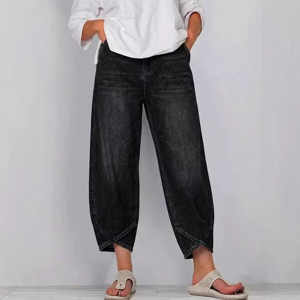 Women's cropped barrel leg jeans featuring a unique curved leg design. Stylish mid-rise denim pants.