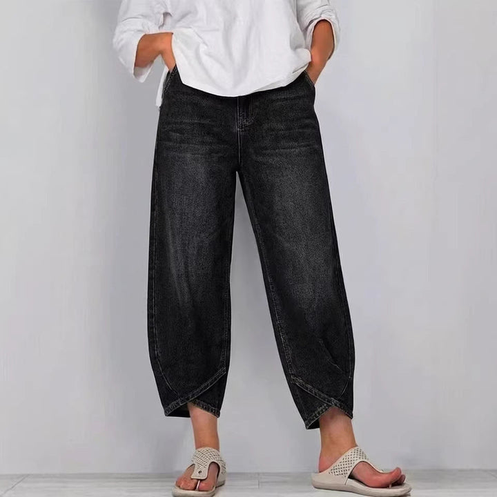 Women's cropped barrel leg jeans featuring a unique curved leg design. Stylish mid-rise denim pants.