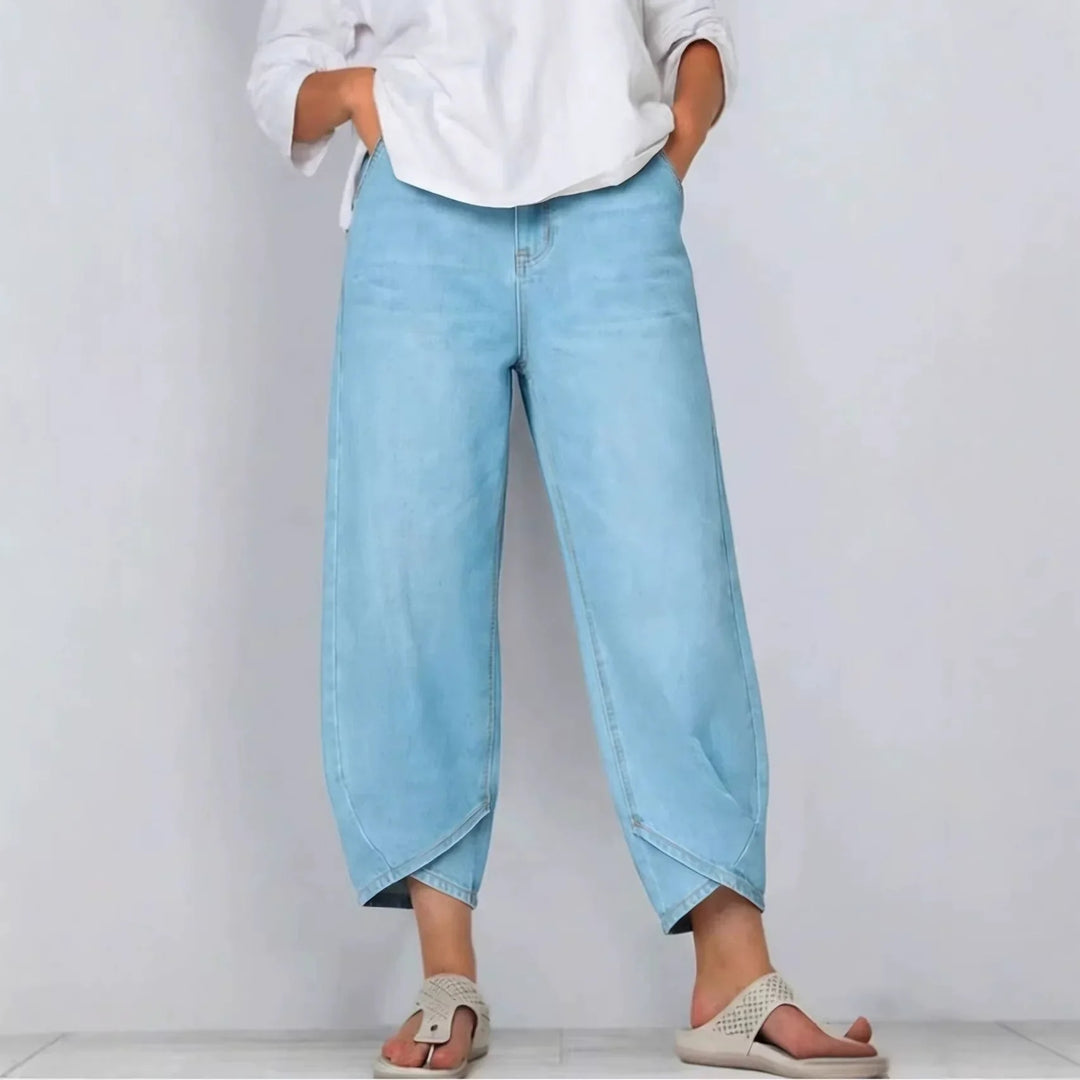 Stylish women's cropped barrel leg jeans, mid-rise fit for versatile casual wear. Modern denim pants.