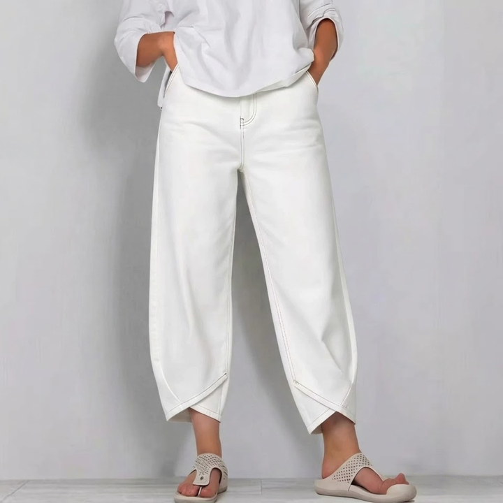 Modern women's barrel leg cropped jeans. Casual mid-rise denim pants with a stylish curved leg for everyday wear.
