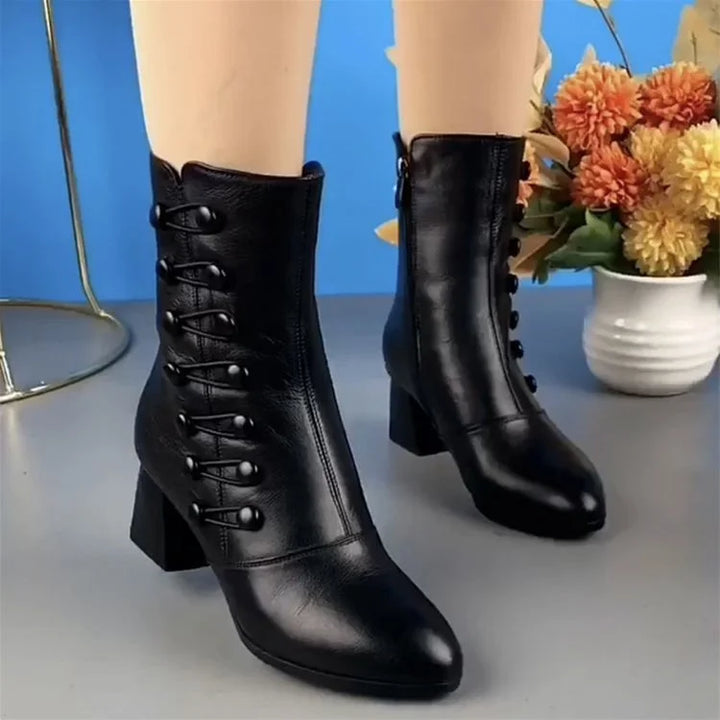 Modern women's black ankle boots with a stylish heel, great for adding flair to any outfit.