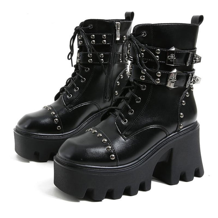Edgy women's black platform ankle boots with gothic influence, ideal for a bold fashion statement.