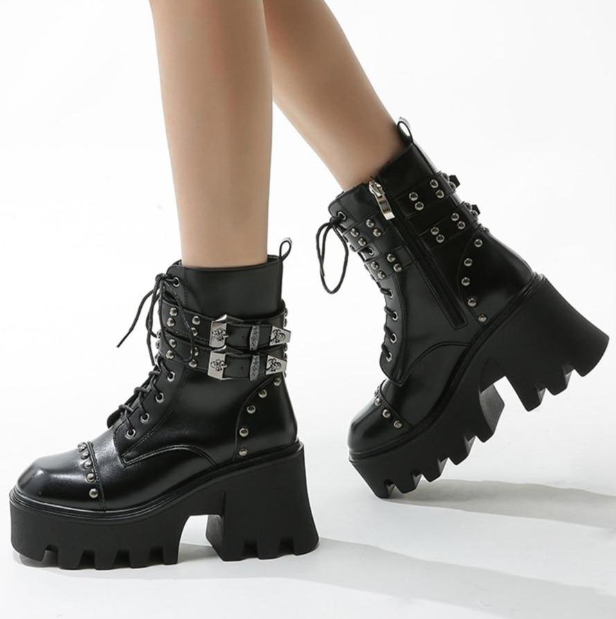 Trendy women's black platform ankle boots, offering elevated style and comfort for everyday wear.