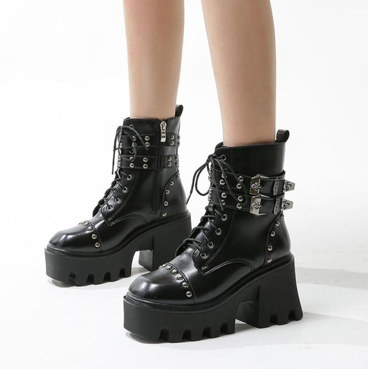 Black faux leather platform ankle boots for women, blending edgy style with comfort and durability.