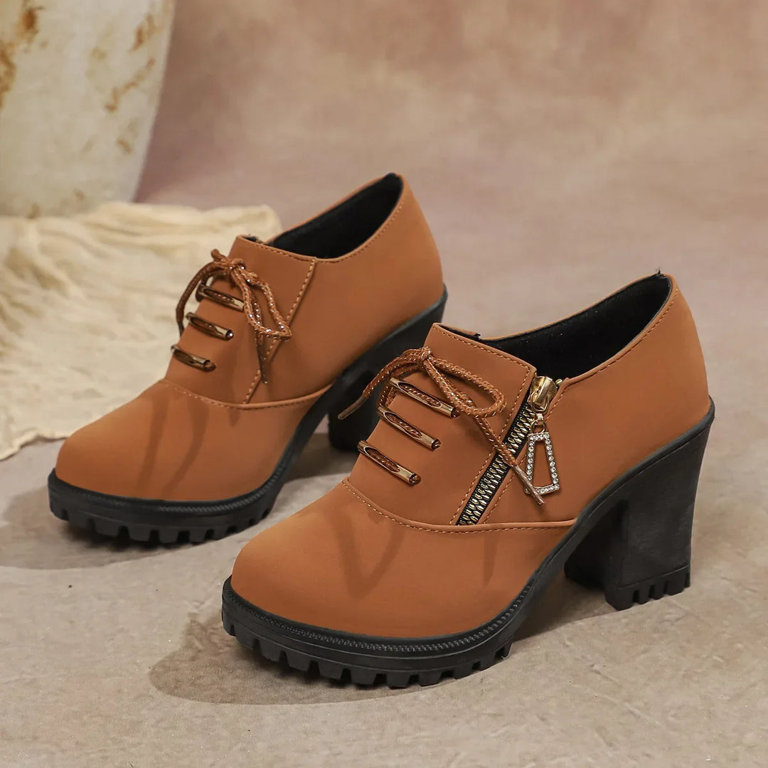 Fashionable women's block heel dress shoes, versatile for everyday or evening, with zipper accent.