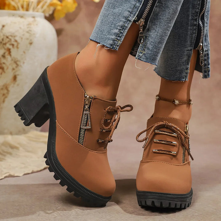 Sleek black block heels for women, offering comfortable fit and a trendy lace-up closure.