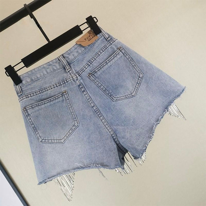 Boho chic women's blue shorts featuring stylish tassels, perfect for summer casual wear and beach days.