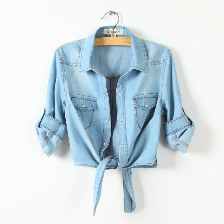 Stylish blue long sleeve button-down shirt for women. Features a trendy tie-front design, great for casual outfits.
