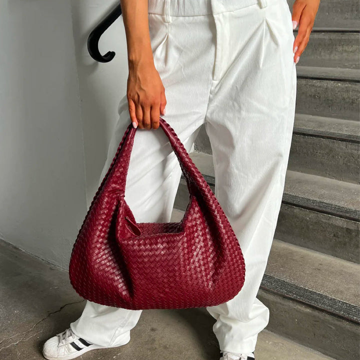 Women's stylish braided woven shoulder bag, an elegant fashion accessory for daily use.