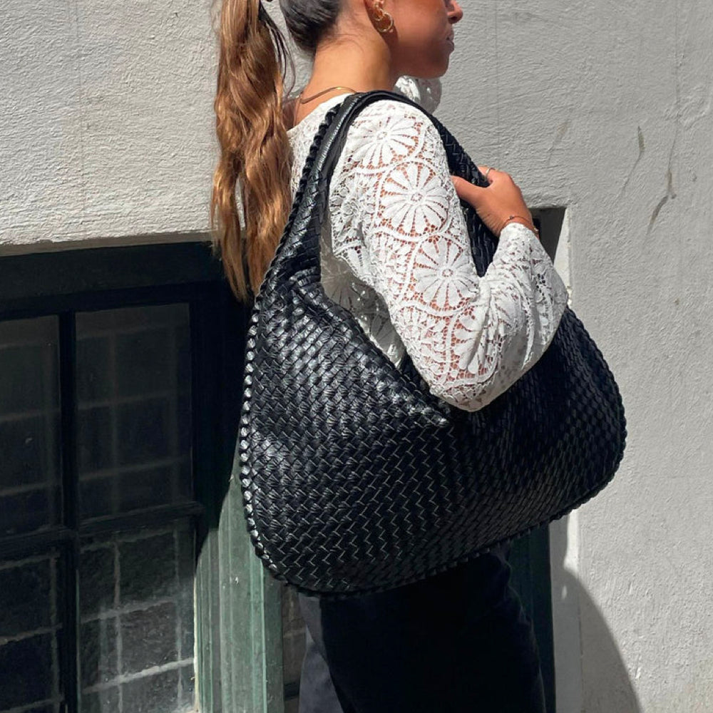 Stylish woven design women's shoulder bag, a versatile braided handbag and fashion accessory.