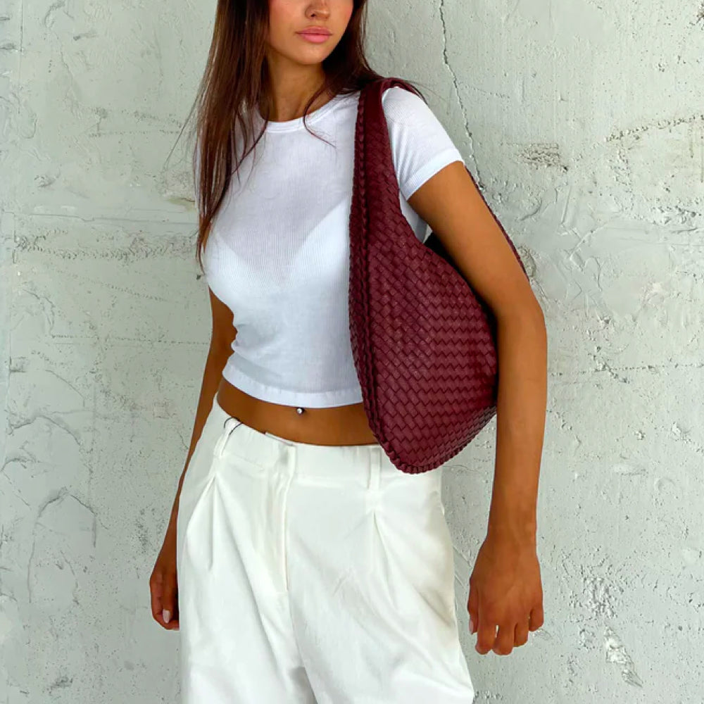 Versatile women's braided woven shoulder bag, an elegant daily use handbag and classic fashion accessory.