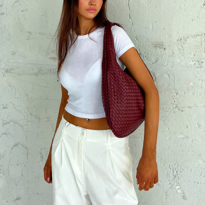 Versatile women's braided woven shoulder bag, an elegant daily use handbag and classic fashion accessory.