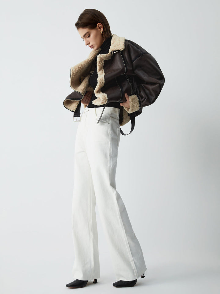 Elegant brown aviator jacket for women. This versatile leather outerwear adds modern chic to any casual outfit.