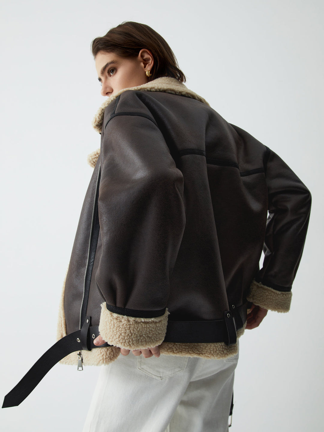 Luxurious brown leather flight jacket for women, a stylish aviator design offering chic versatility for fall and spring.