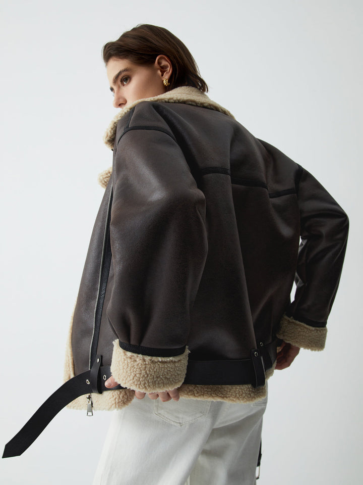 Luxurious brown leather flight jacket for women, a stylish aviator design offering chic versatility for fall and spring.