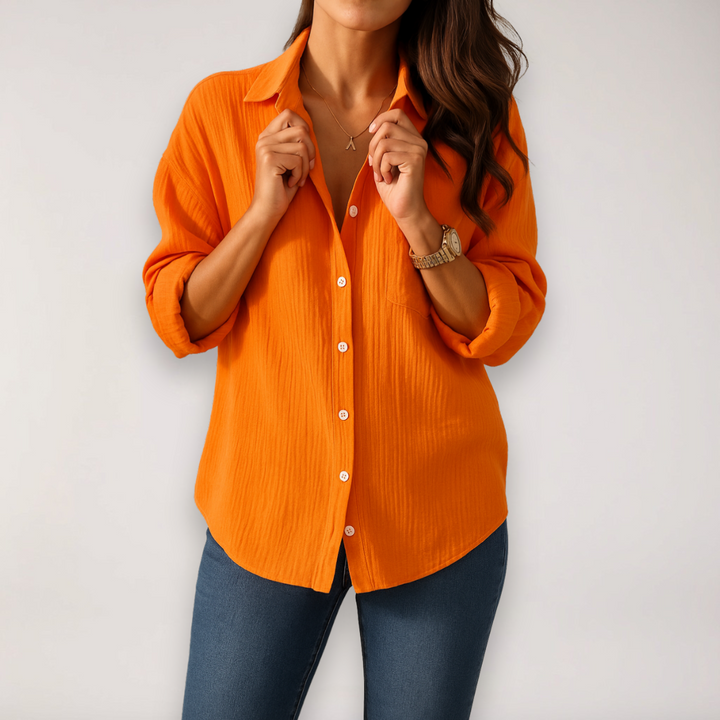 Versatile women's button blouse, comfortable for everyday wear, featuring stylish roll-up sleeves.