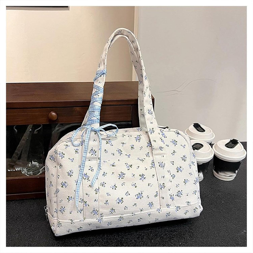 Open Floria canvas weekender bag showing spacious interior, women's large bow duffle for travel