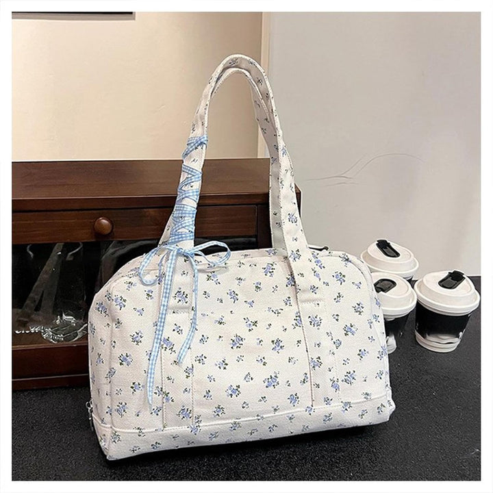 Open Floria canvas weekender bag showing spacious interior, women's large bow duffle for travel