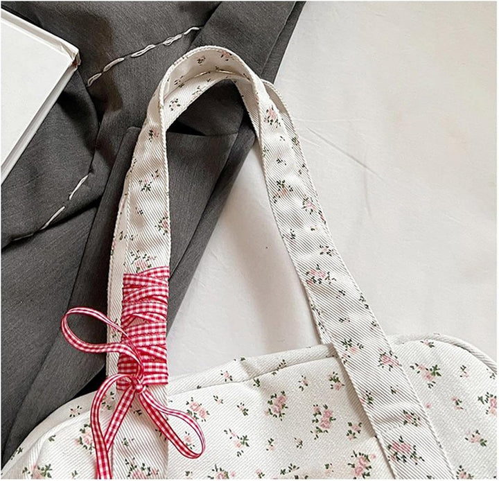 Fashionable women's duffle bag, canvas weekender with a stylish ribbon bow, great for travel