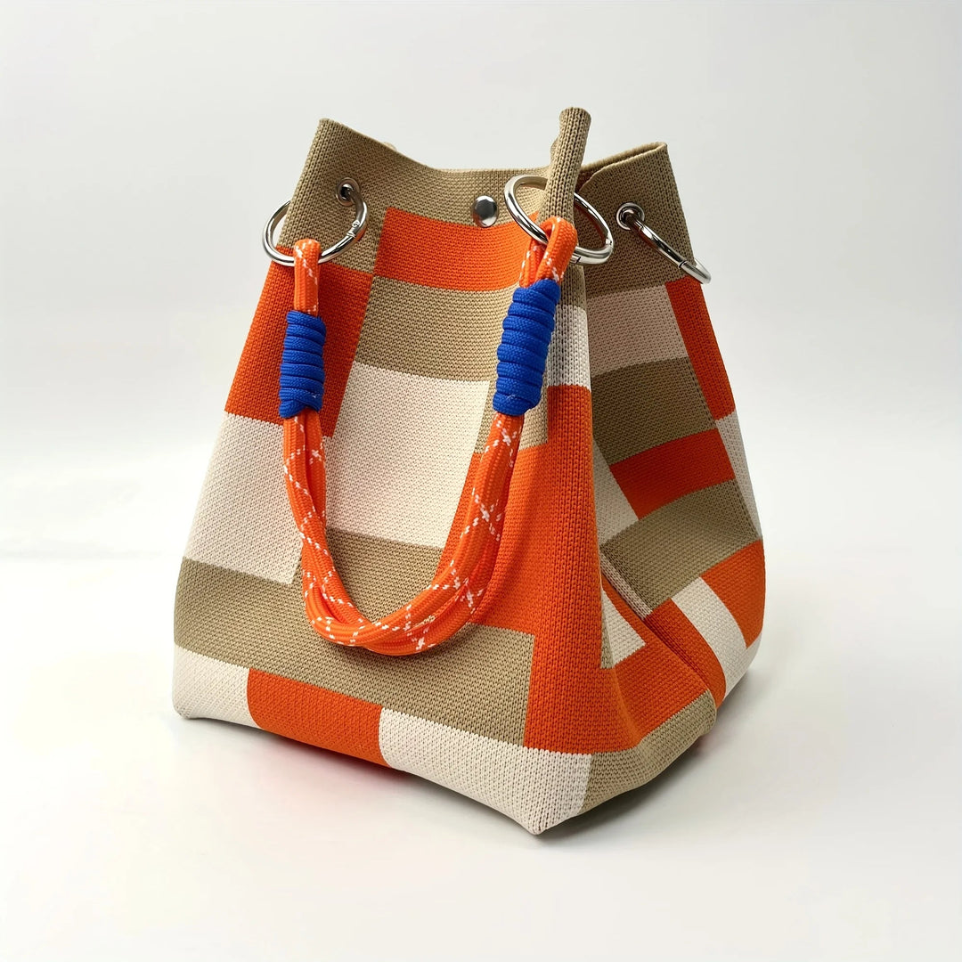 Compact women's canvas mini bucket bag featuring unique patchwork design. A stylish shoulder & crossbody fashion accessory.