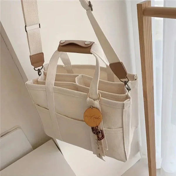 Women's stylish canvas tote bag with zipper closure, perfect for everyday use. UrbanGrace design.