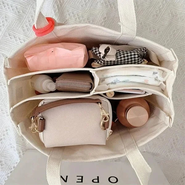 Spacious canvas travel carryall for women, durable and features a secure top zipper closure for essentials.
