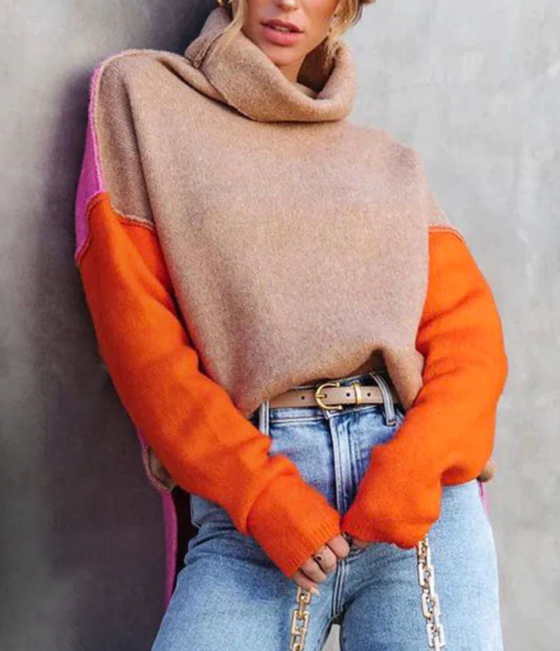 Women's color block knitted sweater, a trendy fall fashion statement piece. Cozy long sleeve pullover.