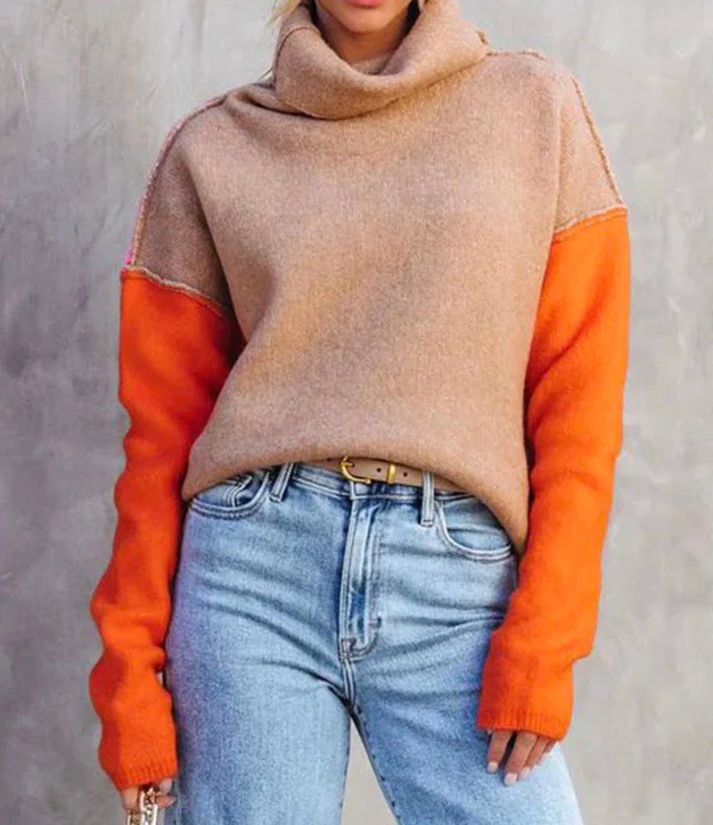 Eye-catching color block knitted sweater, a chic fall fashion statement. Cozy long sleeve top.