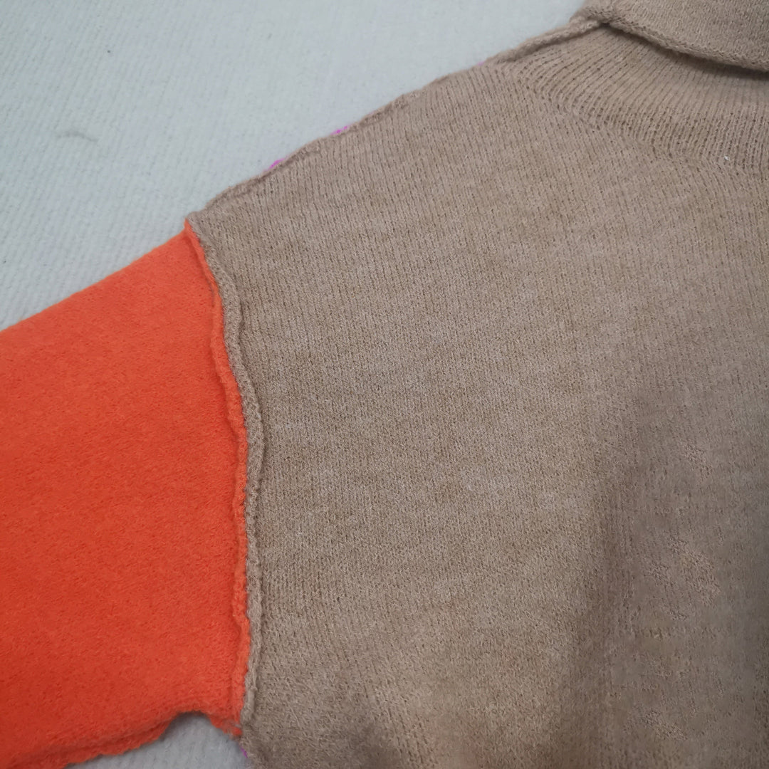 Modern color block knitted sweater for women. Trendy fall fashion pullover, cozy long sleeve design.
