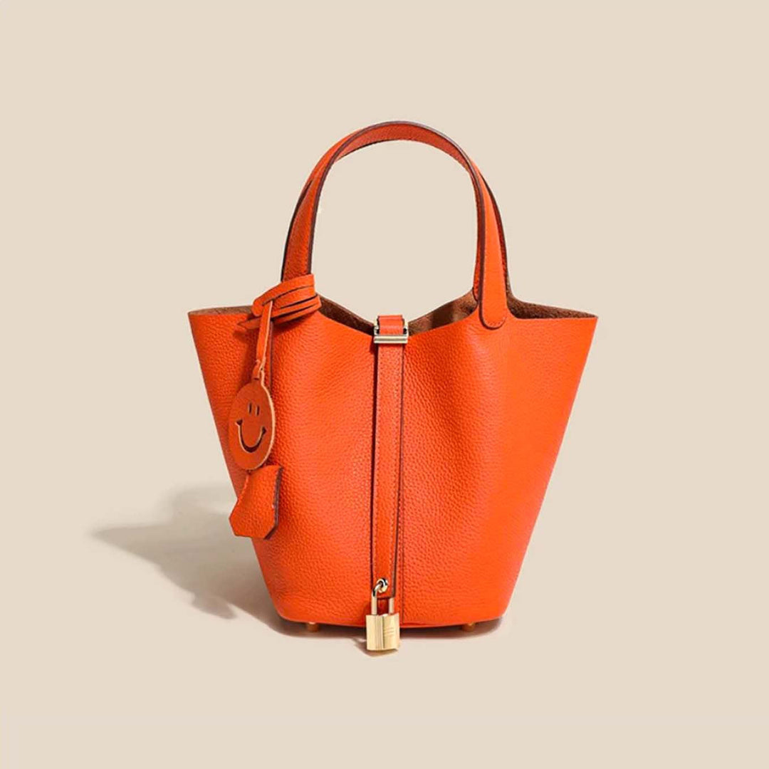 Stylish women's leather bucket bag with drawstring closure, a sophisticated daily use handbag.