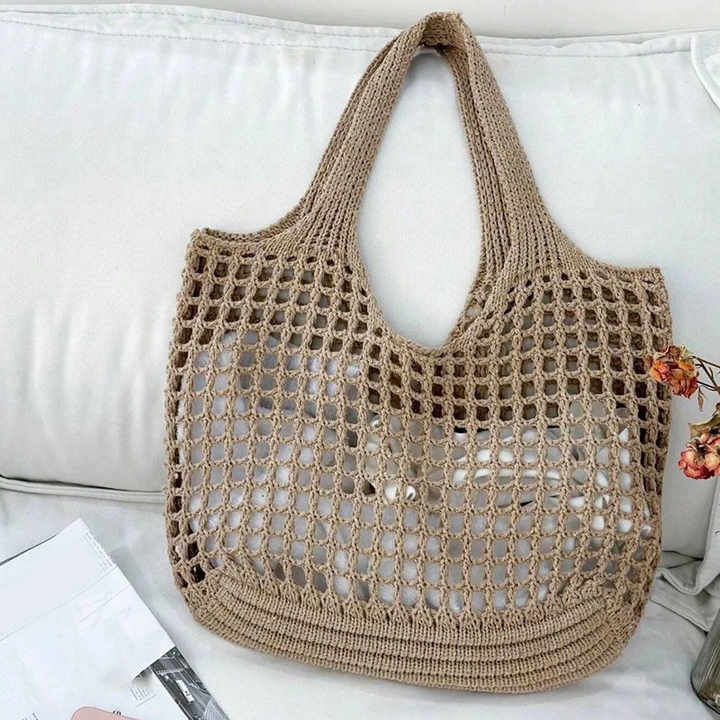 Trendy summer crochet bag, a stylish shoulder tote for women's fashionable look.