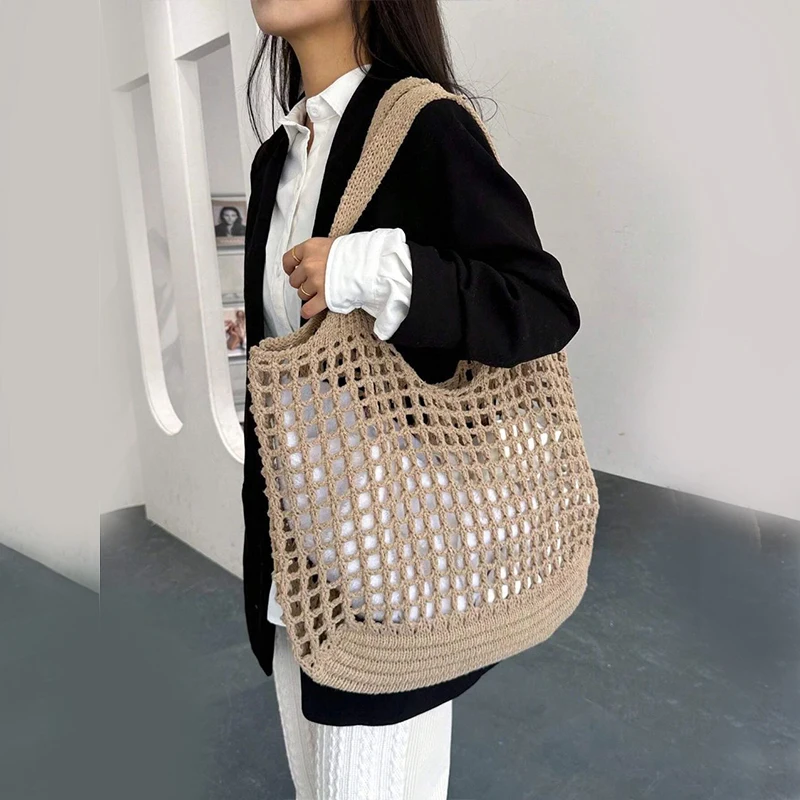 Foldable crochet carryall tote bag, easy to pack for trips, beach, or shopping.