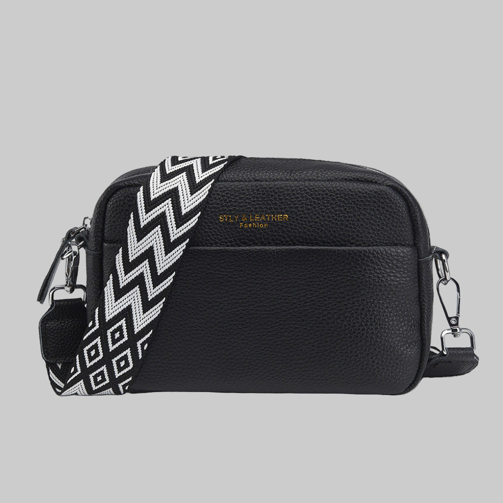 Women's stylish crossbody bag with unique geometric strap. Versatile everyday fashion accessory.