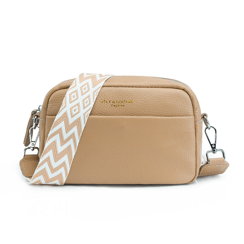 Stylish women's handbag: a versatile crossbody with a distinct geometric strap & ample space.